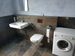 Das Badezimmer mit Waschmaschine