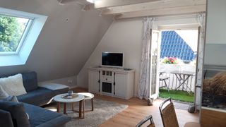 Wohnbereich mit Balkon der Ferienwohnung Seeglück