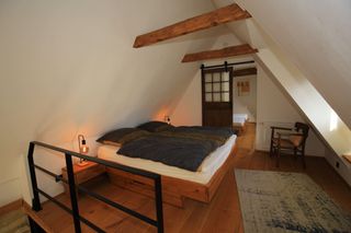 Schlafzimmer mit Dopplbett im Ferienhaus Sandsteintraum in Billerbeck