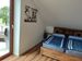 Schlafzimmer 1 mit großem Doppelbett und Zugang zum Balkon