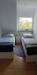 Schlafzimmer mit Einzelbetten in der Ferienwohnung am Kleeberg in Lengerich